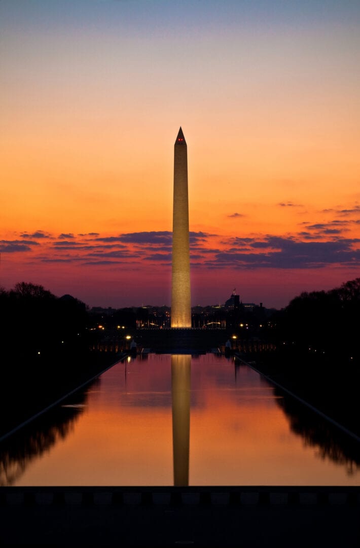 A view of the washington monument at sunset.